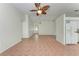 Spacious living area features tile flooring and view of kitchen and front door at 7810 34Th E Ct, Sarasota, FL 34243