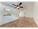Living area features wood floors and an opening view into the kitchen at 7810 34Th E Ct, Sarasota, FL 34243