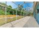 Outdoor patio featuring a full screen enclosure with a view of the backyard at 7810 34Th E Ct, Sarasota, FL 34243