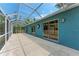 Large screened-in patio with access to the backyard and sliding glass doors at 7810 34Th E Ct, Sarasota, FL 34243