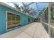 View of covered outdoor patio with access to backyard with lush green lawn at 7810 34Th E Ct, Sarasota, FL 34243