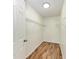 Walk-in Closet featuring wood-look floors and metal shelving at 7810 34Th E Ct, Sarasota, FL 34243