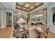 Bright living room with fireplace and outdoor views offers a relaxing atmosphere at 8105 Warwick Gardens Ln, University Park, FL 34201