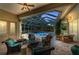 Outdoor patio seating area overlooking screened-in pool and lush landscaping at 8105 Warwick Gardens Ln, University Park, FL 34201