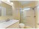 Modern bathroom featuring a glass enclosed shower and a vanity with marble counters at 8408 Whispering Woods Ct, Lakewood Ranch, FL 34202