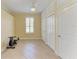 Bedroom with tile floors, ceiling fan, storage cabinets and window with shutters at 8408 Whispering Woods Ct, Lakewood Ranch, FL 34202