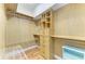 Walk-in closet with built in shelves, drawers, and hanging rods for organizing clothes at 8408 Whispering Woods Ct, Lakewood Ranch, FL 34202