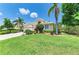 Charming home featuring vibrant landscaping and a well-maintained lawn, offering great curb appeal at 8408 Whispering Woods Ct, Lakewood Ranch, FL 34202