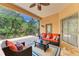 Relaxing lanai offers an outdoor seating area and tranquil views of the surrounding landscape at 8408 Whispering Woods Ct, Lakewood Ranch, FL 34202