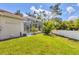 Backyard featuring a screened-in pool and green grass at 8604 15Th Nw Ave, Bradenton, FL 34209