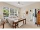 Bright bedroom features a large window, neutral carpet, and ensuite bathroom at 8604 15Th Nw Ave, Bradenton, FL 34209