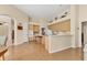 Spacious kitchen features wood floors and cabinets, light countertops, and modern appliances at 8604 15Th Nw Ave, Bradenton, FL 34209