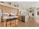 Bright kitchen with island, breakfast bar, and view of the adjacent living area at 8604 15Th Nw Ave, Bradenton, FL 34209