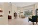 An inviting living room features tile floors, large windows and comfortable seating with pool view at 8604 15Th Nw Ave, Bradenton, FL 34209