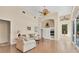 Living room with vaulted ceilings, fan, and built-in entertainment center at 8604 15Th Nw Ave, Bradenton, FL 34209