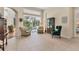 Bright living room features tile flooring, comfortable seating and views of the backyard pool at 8604 15Th Nw Ave, Bradenton, FL 34209