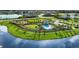 Aerial view of the community pool area featuring a lounge and well-maintained landscaping at 8633 Snowfall St, Sarasota, FL 34241