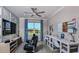 This dedicated workspace is well lit and complete with built in desks and stylish office chairs at 8633 Snowfall St, Sarasota, FL 34241