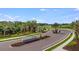 Entrance to Cassia, a Primary-planned community, surrounded by lush landscaping and well-maintained streets at 8633 Snowfall St, Sarasota, FL 34241