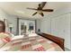 Spacious bedroom with a large bed, private outdoor patio, wood-look floors and a large closet at 9409 Catalina Dr, Bradenton, FL 34210