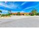 Low-rise building with mature landscaping and palm trees at 9409 Catalina Dr, Bradenton, FL 34210