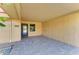 Covered carport featuring a brick floor, providing a sheltered entrance and convenient access to the home's entrance at 9409 Catalina Dr, Bradenton, FL 34210