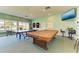 Enjoy recreation in the game room with ping pong tables, a billiards table, and a large TV for entertainment at 9409 Catalina Dr, Bradenton, FL 34210