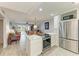 Open-concept kitchen seamlessly connects to the living area, creating a welcoming space for gatherings and everyday living at 9409 Catalina Dr, Bradenton, FL 34210