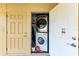 A convenient laundry area with modern stacked washer and dryer units, optimizing space and functionality for easy laundry tasks at 9409 Catalina Dr, Bradenton, FL 34210