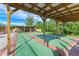 Covered shuffleboard courts with seating areas for community recreation at 9409 Catalina Dr, Bradenton, FL 34210