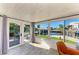 Sunroom with stunning waterfront views and plenty of natural light, wood-look floors and lots of space at 9409 Catalina Dr, Bradenton, FL 34210
