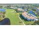Overhead view of condo buildings, pool, and putting green at 9620 Club South Cir # 5304, Sarasota, FL 34238
