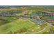 Aerial view of golf course, community amenities, with lake views at 9620 Club South Cir # 5304, Sarasota, FL 34238