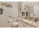 Accessible bathroom featuring a granite countertop vanity and a shower with a glass door at 9620 Club South Cir # 5304, Sarasota, FL 34238