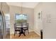 Bright breakfast nook with a round table, pendant lighting, and views of the surrounding landscape at 9620 Club South Cir # 5304, Sarasota, FL 34238