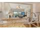 Granite countertops in a kitchen that features a pass-through to the living room at 9620 Club South Cir # 5304, Sarasota, FL 34238