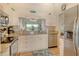 Updated kitchen boasts stainless appliances, granite counters, and a pass-through to the dining area at 9620 Club South Cir # 5304, Sarasota, FL 34238