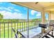 Screened lanai with golf course views, table and chairs, perfect for outdoor entertaining at 9620 Club South Cir # 5304, Sarasota, FL 34238