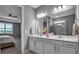 This bathroom features double sinks, modern fixtures, and a sleek design at 10414 Spring Tide Way, Parrish, FL 34219