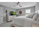 A well-lit bedroom featuring a white bedspread, neutral paint, plush carpet, and lots of space at 10414 Spring Tide Way, Parrish, FL 34219