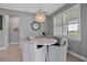 Cozy dining area with a round table, comfortable seating, and a stylish pendant light fixture at 10414 Spring Tide Way, Parrish, FL 34219