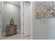Bright hallway featuring stylish decor and a glimpse into adjacent rooms, creating an inviting atmosphere at 10414 Spring Tide Way, Parrish, FL 34219