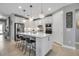 Stylish kitchen with a large island, bar seating, and modern lighting fixtures, creating an inviting space at 10414 Spring Tide Way, Parrish, FL 34219