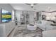 Open living space featuring a modern kitchen, comfortable seating, and bright, natural light, ideal for entertaining at 10414 Spring Tide Way, Parrish, FL 34219