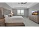 The main bedroom includes a ceiling fan, tile floors, and ample space for furniture at 10414 Spring Tide Way, Parrish, FL 34219