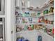 Organized pantry with multiple shelves, offering ample storage space for groceries and household items at 10414 Spring Tide Way, Parrish, FL 34219