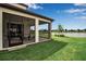 Screened-in patio with views of the lake, offering a perfect spot for outdoor relaxation and entertaining at 10414 Spring Tide Way, Parrish, FL 34219