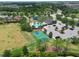 Aerial view of community amenities, including a pool, basketball court, and clubhouse at 11342 77Th E St, Parrish, FL 34219