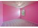 Bright bedroom with neutral carpet, a ceiling fan, and a window for natural light at 11342 77Th E St, Parrish, FL 34219