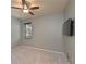 Well-lit bedroom with soft carpet, a large window, and a mounted television for entertainment at 11342 77Th E St, Parrish, FL 34219